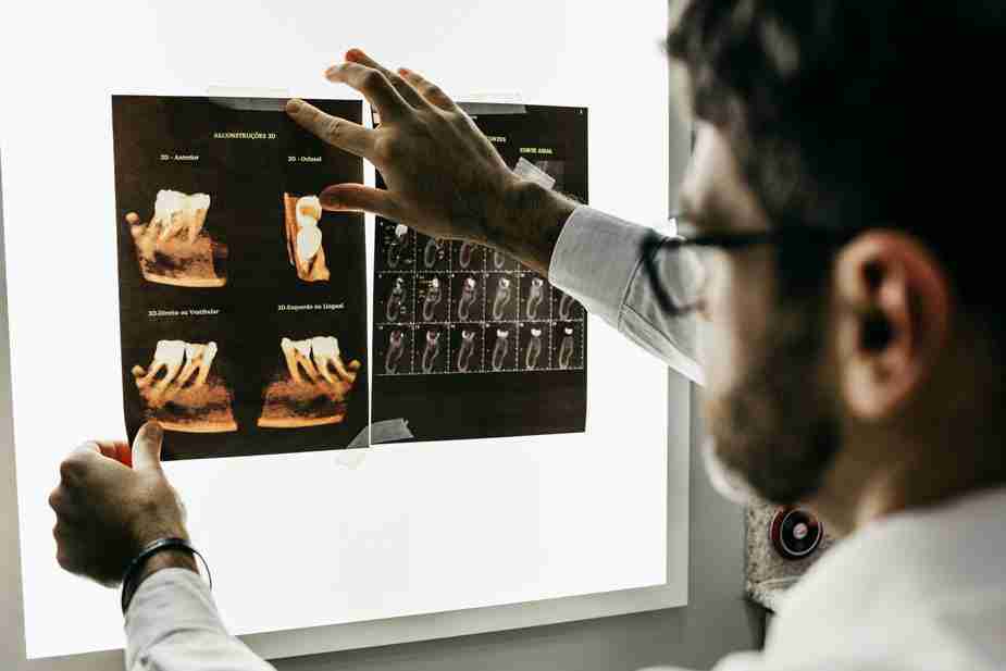 a dentists looking at xrays